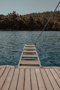 Pier over lake against sky