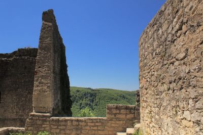 Low angle view of castle against blue sky