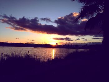 Scenic view of lake against sky during sunset