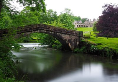 Stone bridge over river manifold at ilam hall