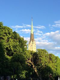 Low angle view of built structure against blue sky