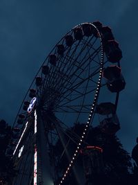 Low angle view of ferris wheel against sky