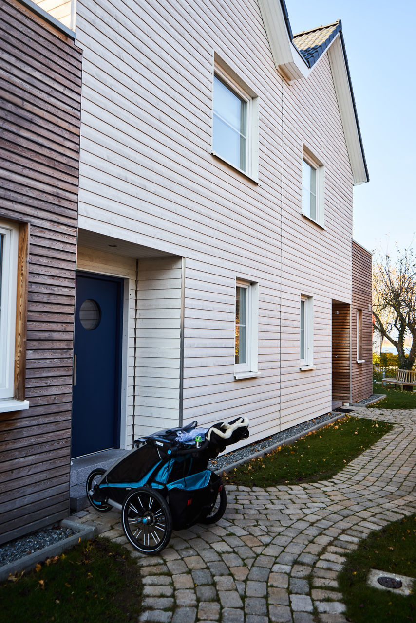 BICYCLE PARKED OUTSIDE HOUSE