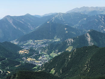 High angle view of valley and mountains against sky