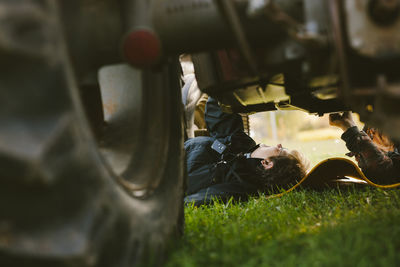 Woman checking tractor