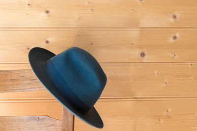 High angle view of blue chair on hardwood floor