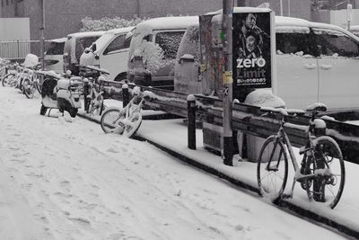 Cars parked on snow covered landscape