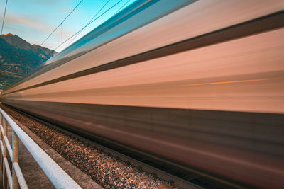 Train at railroad station against sky