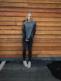 Portrait of smiling young woman standing outdoors