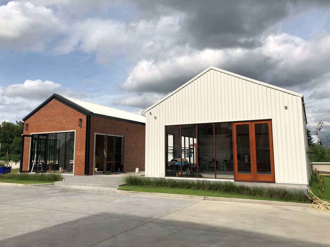 architecture, built structure, cloud - sky, building exterior, building, sky, nature, no people, day, entrance, outdoors, house, facade, home ownership, industry, door, city, sunlight, empty, absence