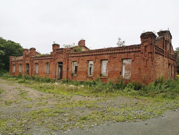 Abandoned building against clear sky