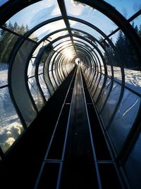 Directly below shot of railroad tracks in tunnel