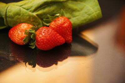 High angle view of strawberries on table