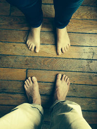 Low section of woman standing on tiled floor