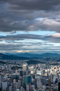 Aerial view of cityscape against sky