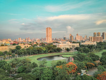 Panoramic view of river and buildings against sky