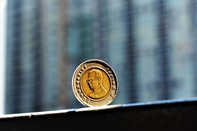 Close-up of coin on metal