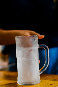 Close-up of beer glass on table