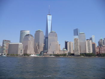 Sea with skyscrapers in background