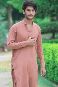 Portrait of young man standing outdoors