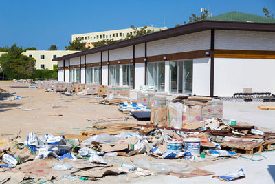 Garbage by building against sky