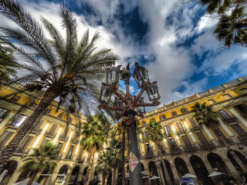 Low angle view of building against cloudy sky