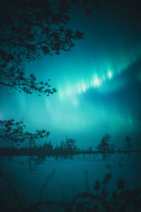 Scenic view of lake against sky at night
