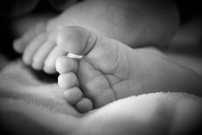 Close-up of baby on bed