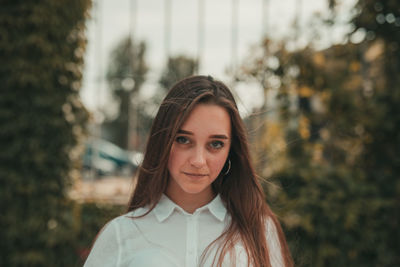 Portrait of smiling woman standing outdoors