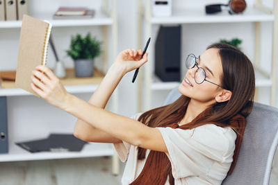 Young woman using mobile phone