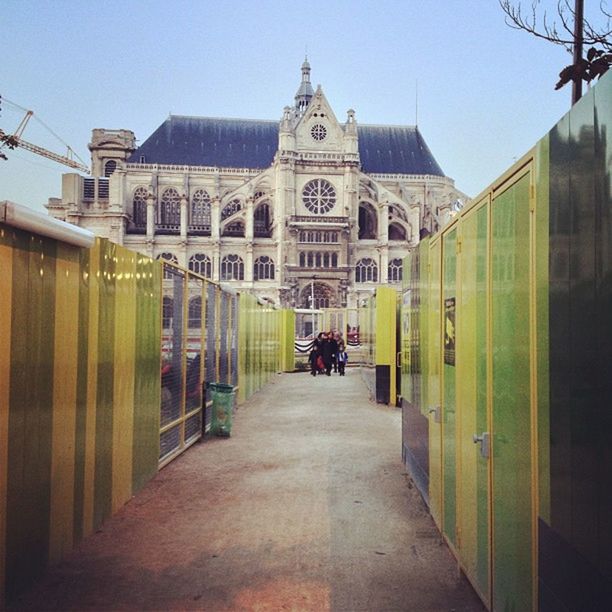 architecture, built structure, building exterior, the way forward, walking, men, diminishing perspective, clear sky, place of worship, lifestyles, religion, rear view, incidental people, person, city, church, vanishing point, full length