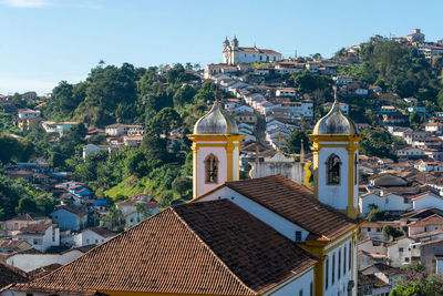 Buildings in city against sky