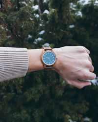 Traveler checking time on wristwatch