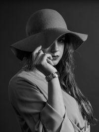 Portrait of young woman in hat