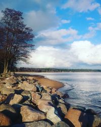 Scenic view of sea against cloudy sky