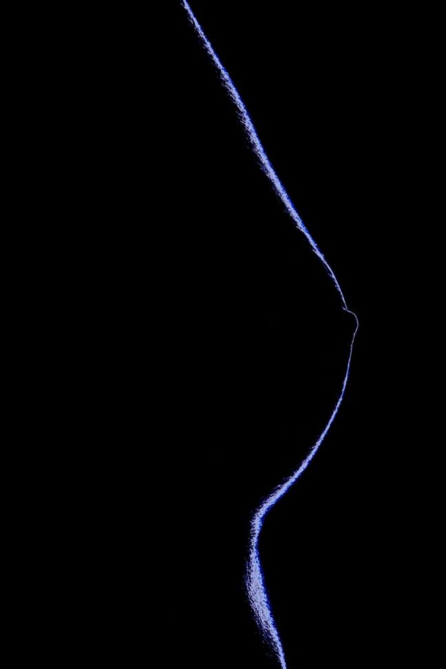 black background, studio shot, copy space, close-up, dark, abstract, night, blue, one person, cut out, single object, part of, indoors, light - natural phenomenon, ideas, pattern, detail, light effect, purple