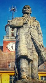 Low angle view of statue against building