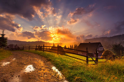 Scenic view of field against sky during sunset