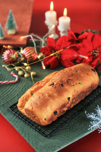 Christmas stollen. traditional sweet fruit loaf german bread with icing sugar. xmas holiday table 