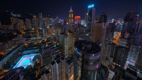 Aerial view of illuminated buildings in city at night