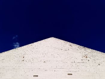 Low angle view of historical building against blue sky