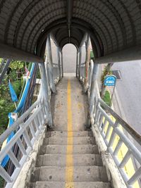 Empty corridor along bridge