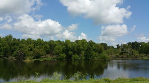 Scenic view of lake against cloudy sky