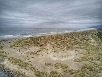 Scenic view of beach against sky