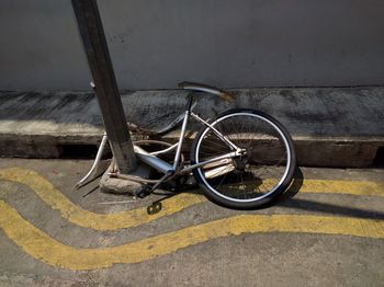 High angle view of damaged bicycle on street