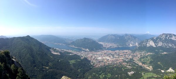 High angle view of mountains against blue sky