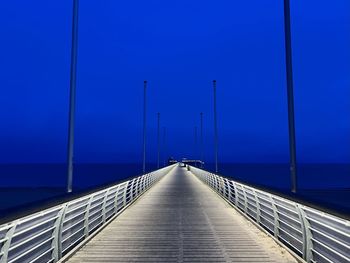 Pier over sea against sky