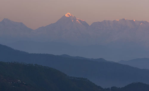 Scenic view of mountains against sky during sunset