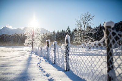 Panoramic view of snow covered landscape against sky