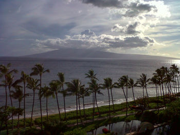 Scenic view of sea against cloudy sky